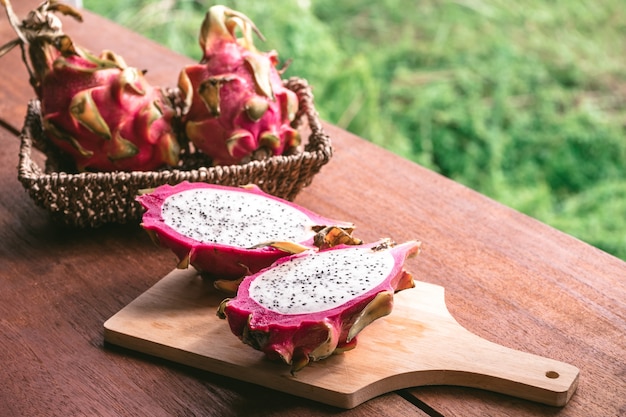 Fresh dragon fruit on wooden table