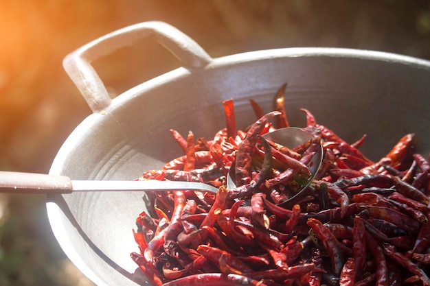 Fresh dried chilies in the pan to roast