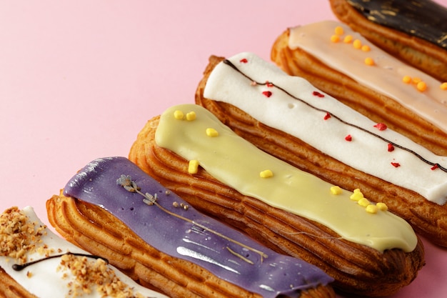 Fresh eclair cakes on pink close up