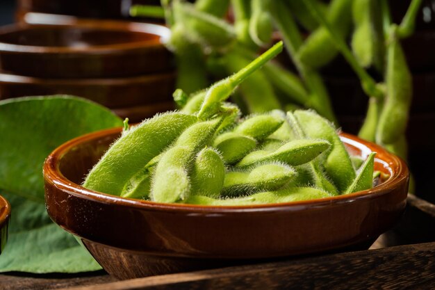 Fresh edamame on a wooden plate