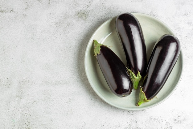 Fresh eggplants on the table