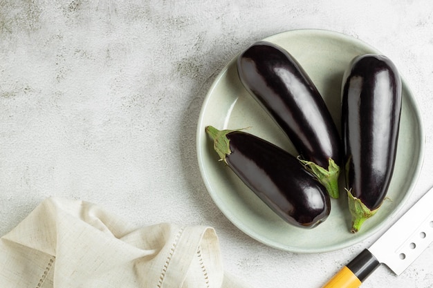 Fresh eggplants on the table