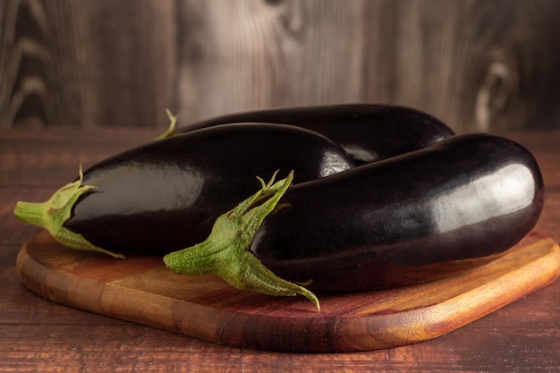 Fresh eggplants on the table