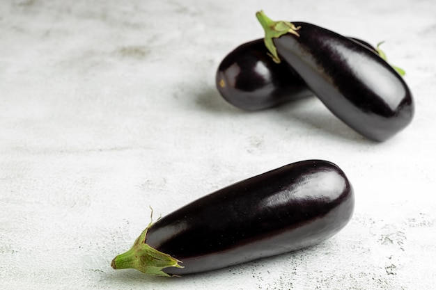 Fresh eggplants on the table