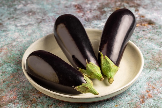 Fresh eggplants on the table