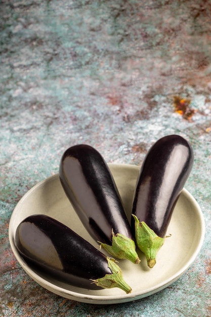 Fresh eggplants on the table