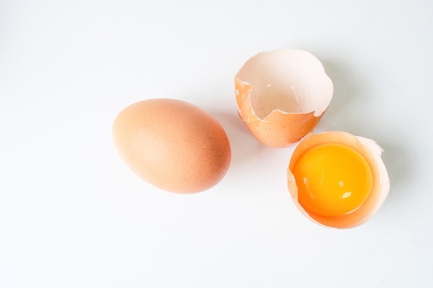 Fresh eggs from the farm placed on a white wooden table background