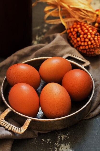 Fresh eggs with corn in vintage and rustic style