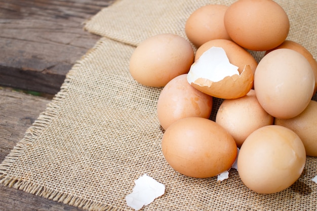 Fresh eggs on wooden background