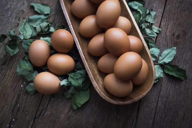 fresh eggs on wooden floor.