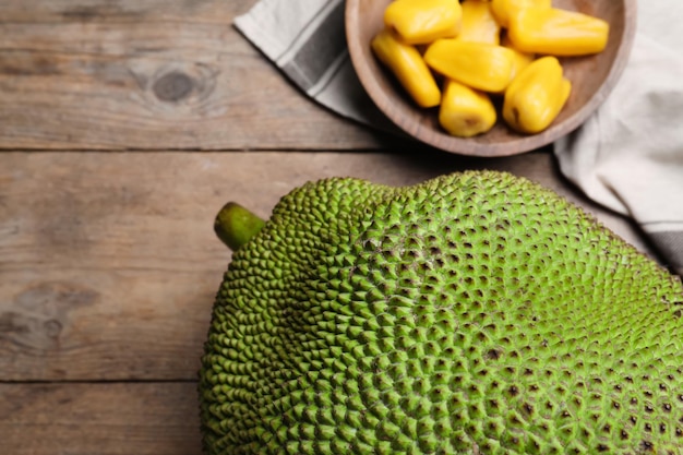 Fresh exotic jackfruit on wooden table above view