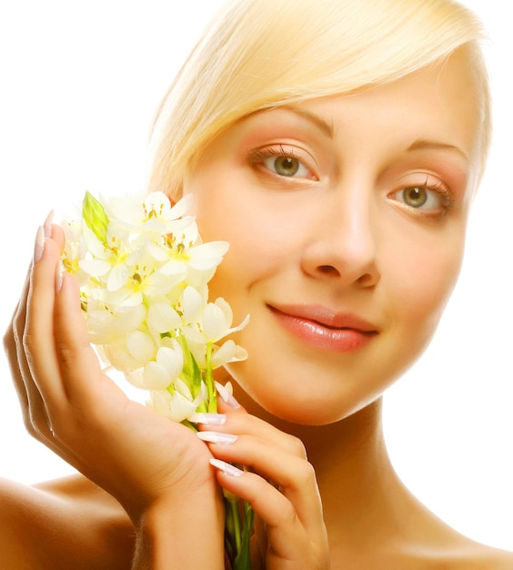 Fresh face with gladiolus flowers in her hands