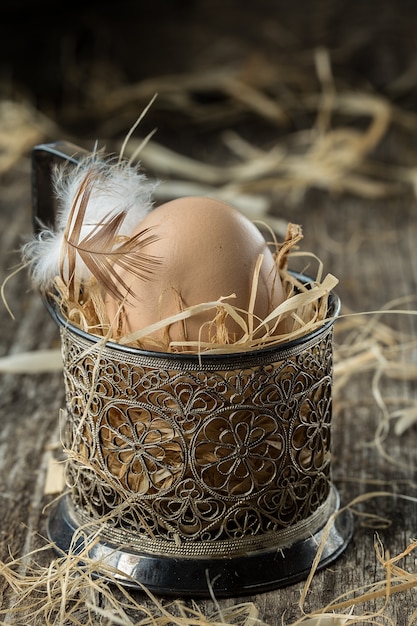  Fresh farm eggs. Easter egg with feather concept