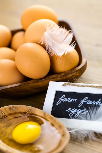 Fresh farm eggs on the wood table.