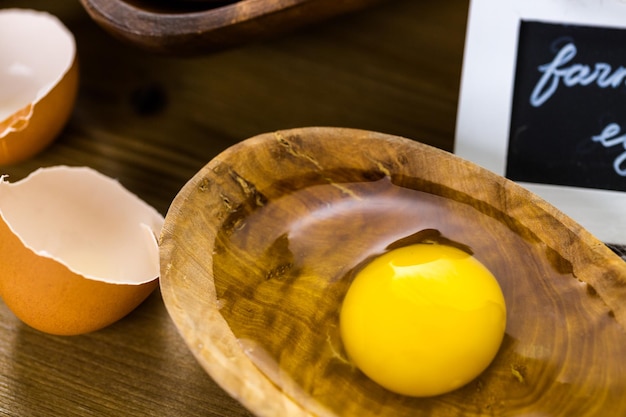 Fresh farm eggs on the wood table.