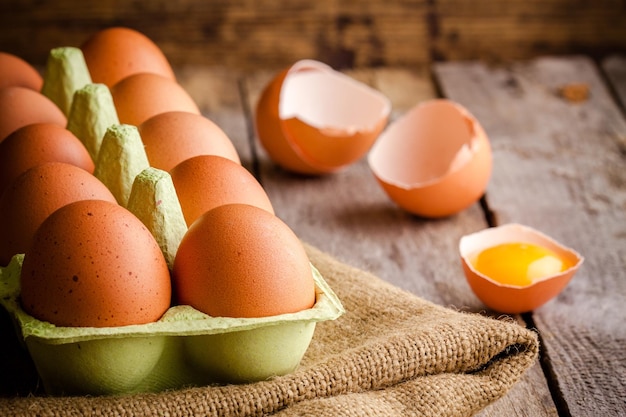 Fresh farm eggs on a wooden rustic background