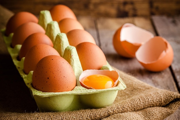 Fresh farm eggs on a wooden rustic background