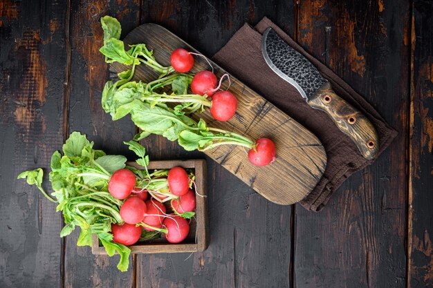 Fresh farm radish, rustic background. Natural eco products set, on old dark  wooden table