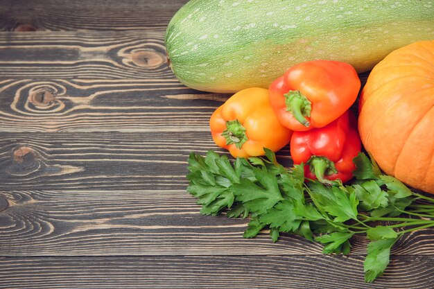 Fresh farmers garden vegetables on wooden table