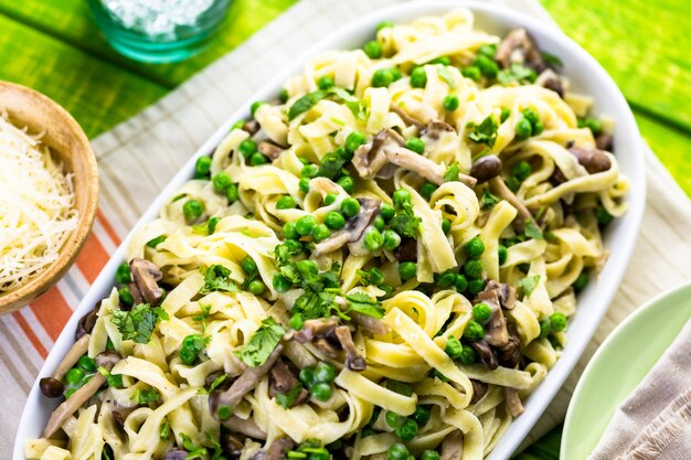 Fresh fettuccine with creamy mushroom sauce.