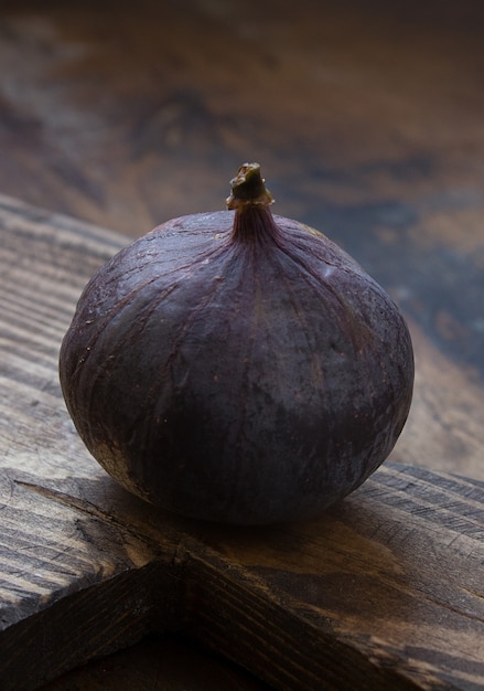 Fresh fig fruit on a dark wall