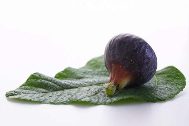 Fresh fig and Leaves on white