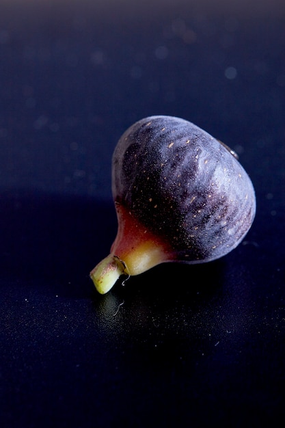 Fresh figs on black background