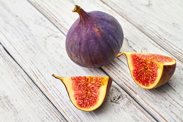 Fresh figs on gray wooden background