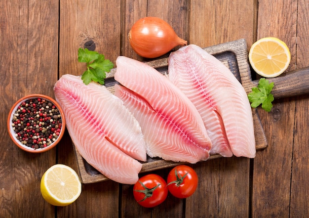 Fresh fish fillet with ingredients for cooking