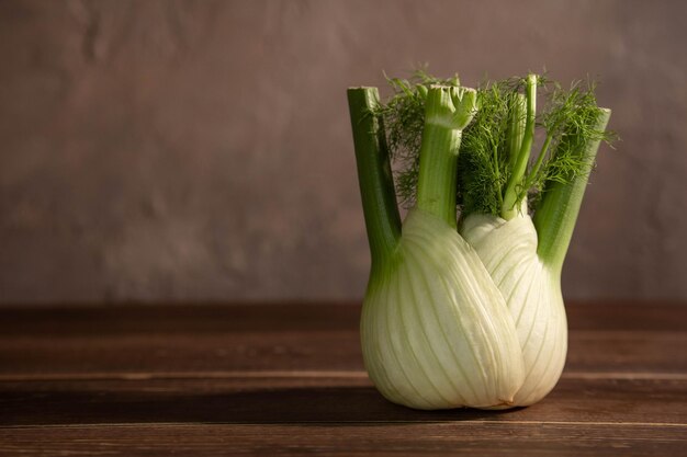 Fresh Florence fennel bulbs or Fennel bulb on wooden background Healthy and benefits of Florence fennel bulbs