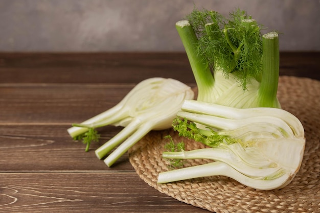 Fresh Florence fennel bulbs or Fennel bulb on wooden background Healthy and benefits of Florence fennel bulbs