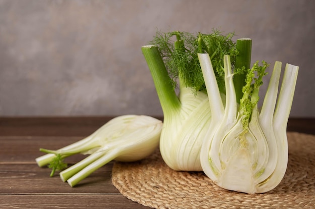 Fresh Florence fennel bulbs or Fennel bulb on wooden background Healthy and benefits of Florence fennel bulbs