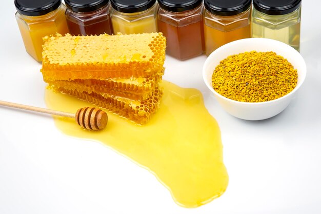 Fresh flower honey in combs and a wooden spoon. vitamin food for health and life