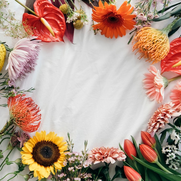 Fresh flower round frame on white background