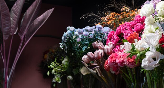 Fresh flowers in floral arrangements on a store shelf