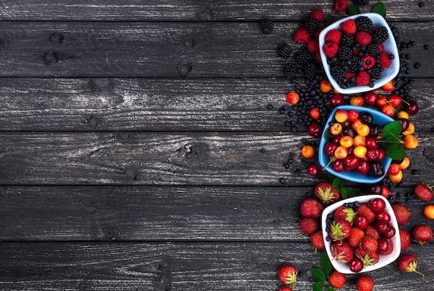 Fresh forest berries on wooden