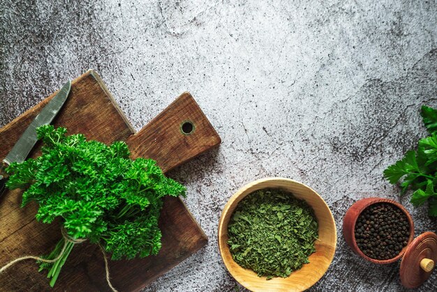 Fresh fragrant farm green and dried parsley pepper peas on a gray concrete background 2