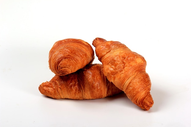 Fresh french croissant on a white background