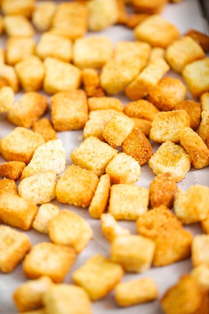 Fresh french toast croutons on baking sheet.