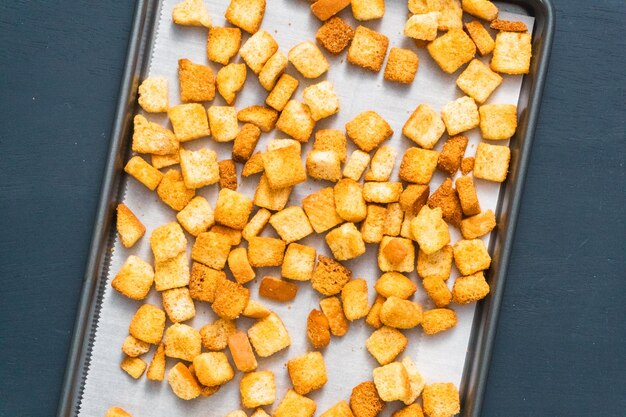 Fresh french toast croutons on baking sheet.