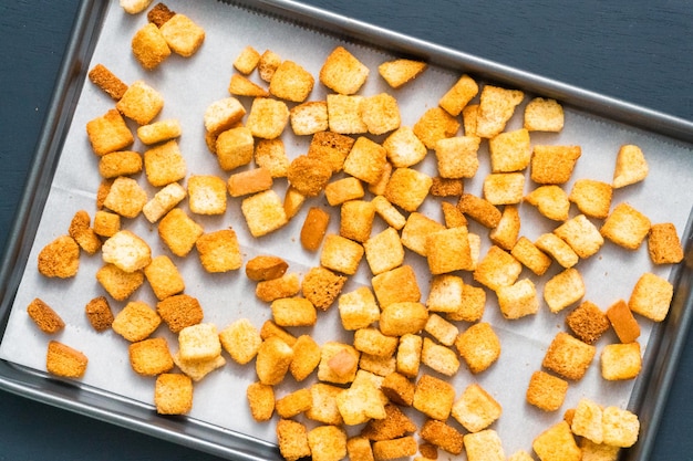 Fresh french toast croutons on baking sheet.