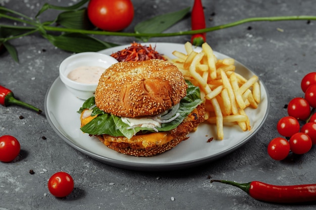 Fresh and fried fish burger with vegetables.