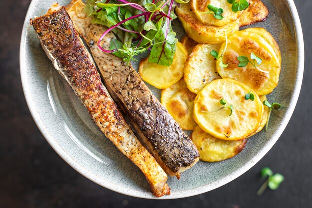 Fresh fried fish and potato slices garnish seafood omega