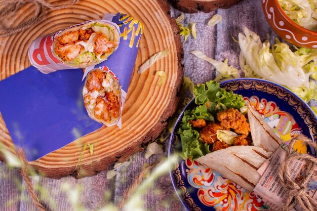 Fresh fried prawns roll with fresh tomatos salad