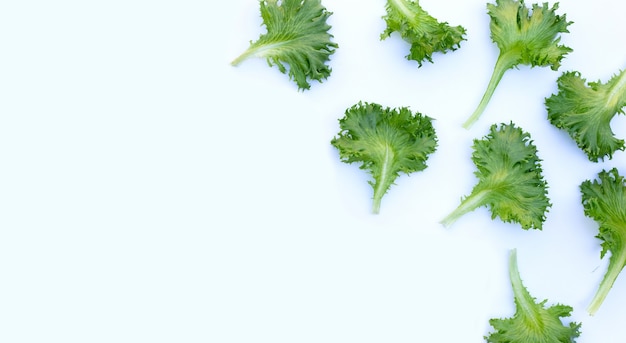 Fresh frillice iceberg lettuce on white surface