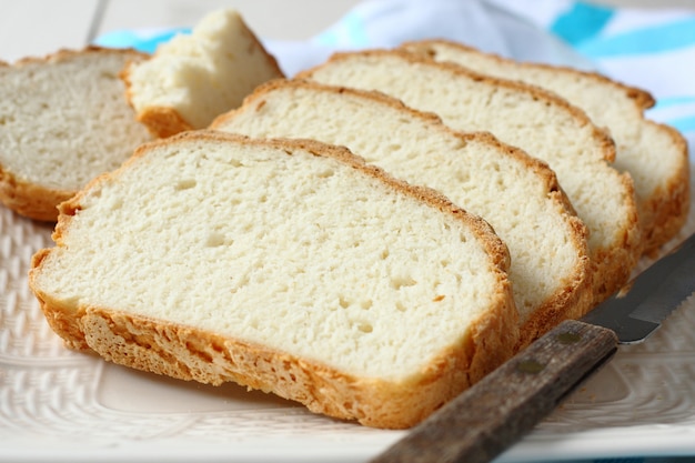 Fresh from the oven sliced gluten free bread on plate