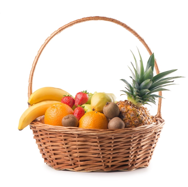 Photo fresh fruit in the basket against a white background