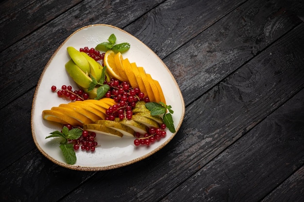 fresh fruit and berries on a plate