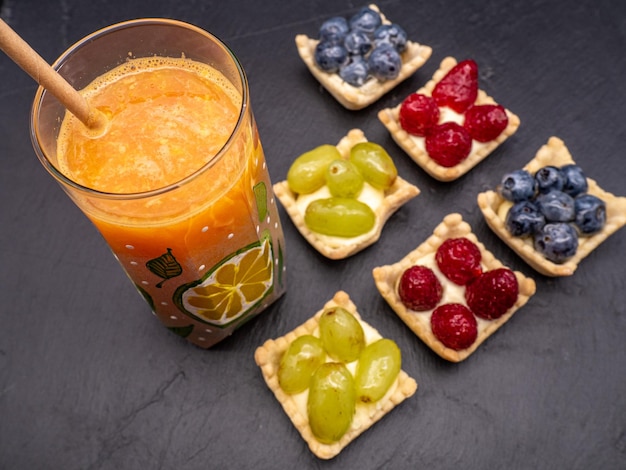 Fresh fruit and berry tart dessert on slate