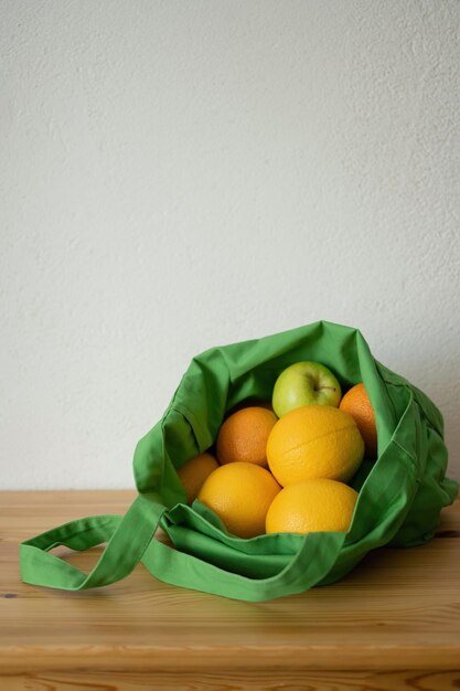 Fresh fruit oranges are in the reusable bag Ecofriendly product Concern for the environment